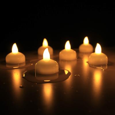 China Garden decoration on/off elertric waterproof elertric flameless led candles touch water battery floating candle for sale