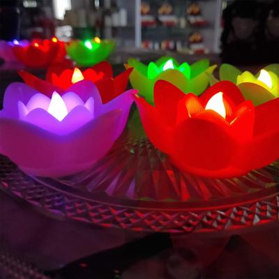 China Flameless candles made of china lotus candles touch water battery operated electric flameless waterproof flower floating led candle for sale