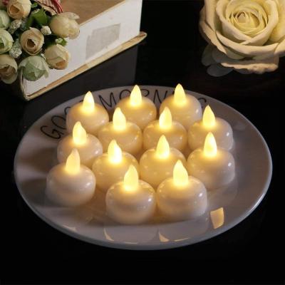 China Flameless Bar Decoration 12 Pcs Waterproof Candle Light Battery Operated Led Floating Candles for sale