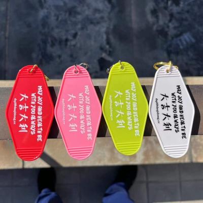 China All Custom Retro Crowd Promotional White Vintage Motel Hotel Room Plastic Key Chain for sale