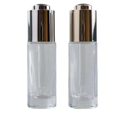 China Wholesale Cosmetic Dropper Cosmetic Clear Glass Bottle 15ml Essential Oil Glass Bottle With Push Dropper for sale