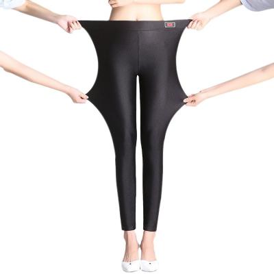 China Anti-wrinkle fleece luster pants thickened high-stretch pants thin-fitting thermal gaiters women nine point pants for sale