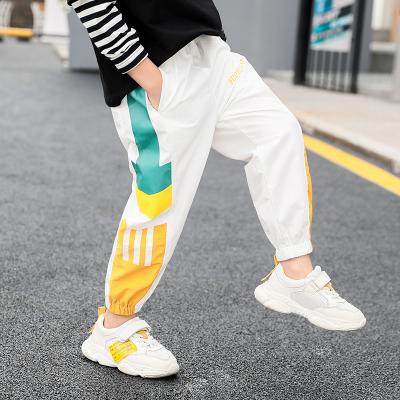 China Color Fade Proof patchwork hit color kids pants boys letter printing street style full length boys culottes lane punk pants for boys for sale