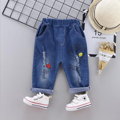 China Children's thermal cute jeans print pattern cartoon elastic waistband children's jeans boys ripped pants children's jeans for sale