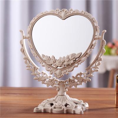 China Custom Floral Vintage Makeup Mirror Tabletop Oval Vanity Mirror with Stand Dressing Room Swivel Decorative Elegant Antique Mirror for sale