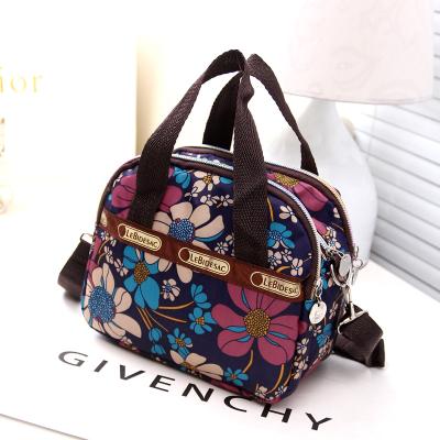 China Female nylon fabric Korean version of flowers 2021 the new hit single stall supply Bag Foreign Trade messenger color shoulder wholesale handbag for sale