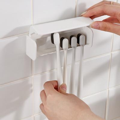 China Durable Dustproof Adhesive Toothbrush Holder High Capacity Hanger 6 Hole Toothbrush Holder Wall Mounted for sale