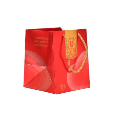 China Recyclable Custom Logo and Size Christmas Gift Red Paper Bag High-end Material Shopping Bags with Handles for sale