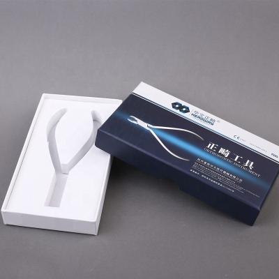 China Disposable custom logo printed EVA foma insert paper packaging box for orthodontic pliers for sale