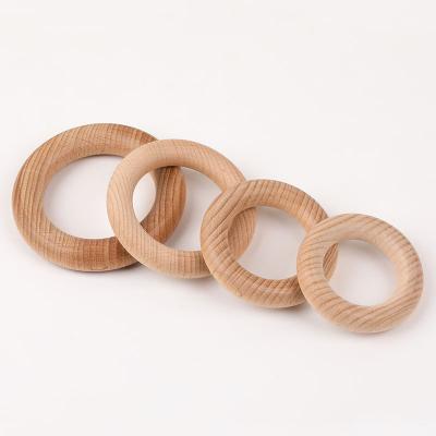 China Food grade Unfinished Smooth Beech Wooden Circle Ring Baby Teether Floral Ring Sensory DIY Toys for sale