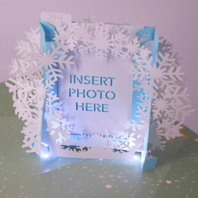 China From Europe OEM Christmas Pop Photo Frame Greeting Card With LED Light And Music for sale