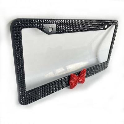 China NO Diamond-encrusted American cute bow license plate frame fashion car license plate appearance decoration frame sparkling car lice for sale