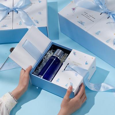 China Custom Disposable Magnetic Double Door Fold Door Perfume Skin Care Gift Open Paper Box Packaging Magnetic Filp Top With Ribbon Tied In A Bow for sale