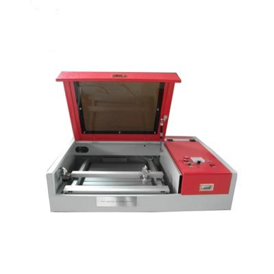 China Laser REDUCING Desktop CO2 Laser Cutting Machines Price For Paper Cutting for sale