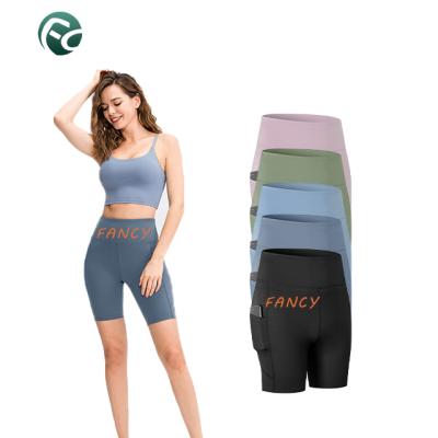 China Anti-Wrinkle Gym Fitness Clothing Half Compression Pants Yoga Shorts Women Workout Clothes Bike Shorts for sale