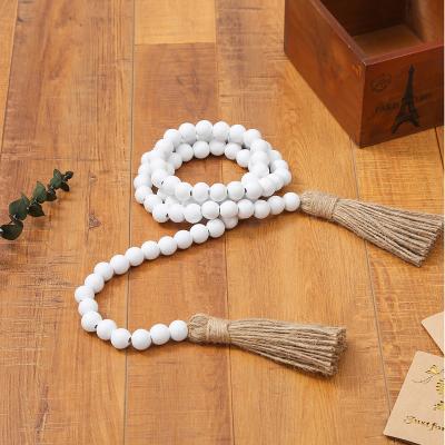 China 58in Eco-friendly Christmas wooden bead garland with tassels decorated with wooden bead garland for Christmas decorations for sale