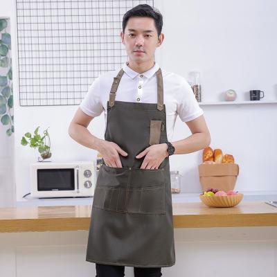 China Manufacturer Eco-Friendly Adjustable Bib Apron, Unisex Black Machine Weave Man With Washable Multi Pockets For Men's Kitchen Restaurant for sale