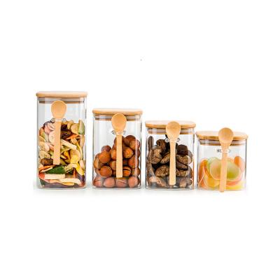 China Modern Air Tight Food Glass Bottles Storage Jar With Bamboo Lid And Spoon Glass Canister for sale