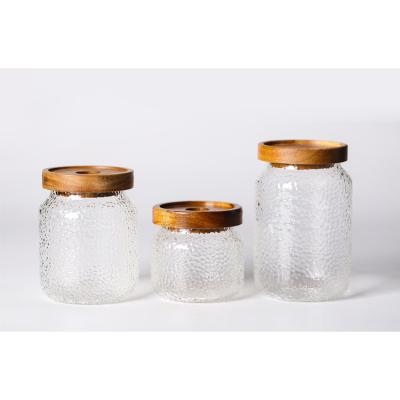 China Modern Bamboo Cover Storage Heat Resistant Glass Jar With Air Tight Lid Glass Wood Bottle for sale