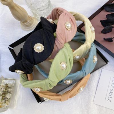 China New Daily Fashion Headband Women Twist Knot Pearl Canvas Knotted Elastic Headband for sale