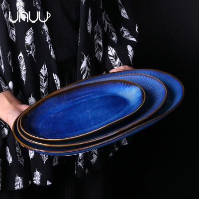 China Sustainable Restaurant Bulk Porcelain Fish Shaped White Ceramic Oval Platter Splint for sale