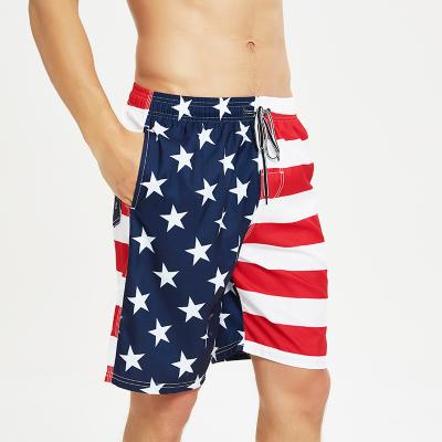 China Fashion QUICK DRY wholesale design national flag printed block elastic waist shorts swim trunks fail abbreviations men for sale