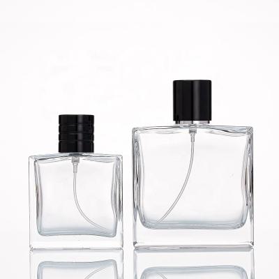 China Hot Sale Cosmetic Luxury Empty Square Spray 50ml 100ml Glass Perfume Bottle With Custom Lid for sale