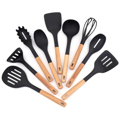 China Sustainable Kitchen 9pcs Black Nonstick Nylon Utensils Set With Wooden Handle Kitchen Cooking Tools for sale