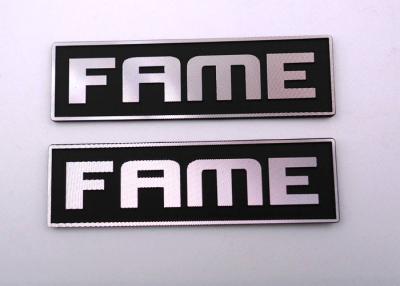 China Customised Paint Black Embossed Metal Tags Logo With Diamond Knife Grain for sale