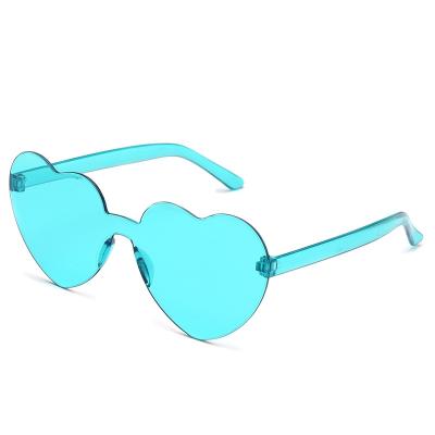 China New Fashion Sunglasses Fashion Rimless Women One Piece Colored Shades Frameless PC Lens Heart Shading Sun Glasses for sale