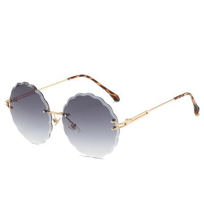 China Fashion Sunglasses Shape Framless Ocean Lens Shades Sun Glasse Metal Oversized Round Retro Rimless Sunglasses 2021 for sale