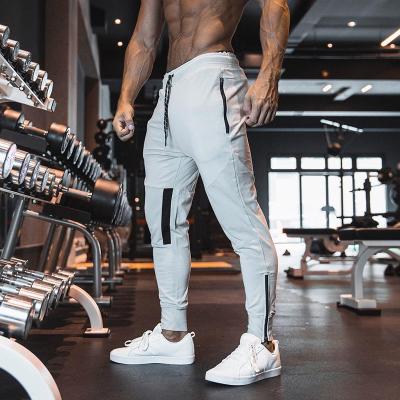 China Wholesale QUICK DRY Mens Track Joggers Pants With Zipper Pockets Elastic Mens Trousers Pants for sale