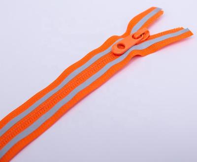 China Best Selling Auto Lock Reverse With Printing Orange Band Open Auto Lock 7# Nylon Zipper With Reflective Mark For Pants for sale