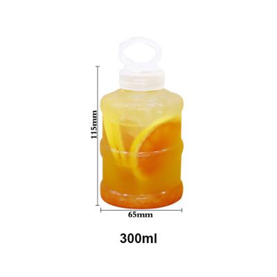 China New Design 300ml 500ml 700ml 1000ml Handle Bubble Tea Beverage Bottle Boba Cha Plastic Lifting Cap Bottle for sale