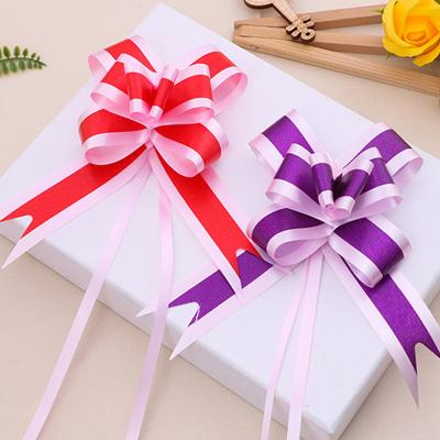 China Iridescent rugby ball Hand drawn flowers Gift strap decoration Festive wedding supplies pull bow for sale