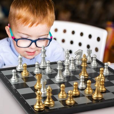 China Eco - Friendly Custom Game Storage Portable Folding Board Game 32 Gold And Silver Chess Pieces For Kids for sale