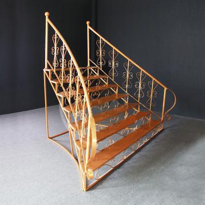 China Beautiful new colorful wedding props elegant gold metal wedding stair decoration for stage for sale