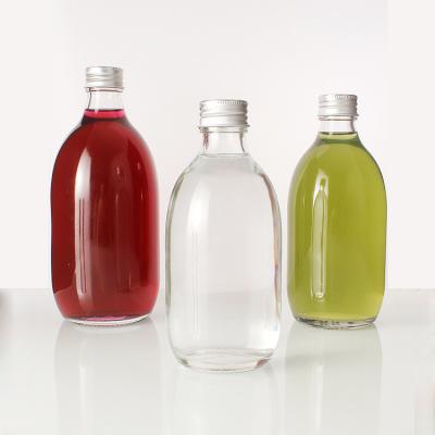 China Juicy Beverage 300ml/350ml/500ml Clear Liquor Bottle Around Milk Juice Glass Empty Wine Bottles for sale