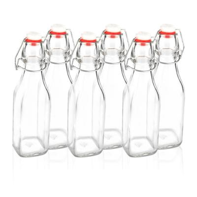 China Empty Square Beverage Liquor Beer Bottles With Loop Swing Top Flip Top Easy Wine Juice Beverage Bottle for sale