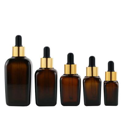 China 10ml/20ml/30ml/50ml/100ml Cosmetic Square Shaped Amber Essential Oil Bottles Glass Dropper Bottle for sale