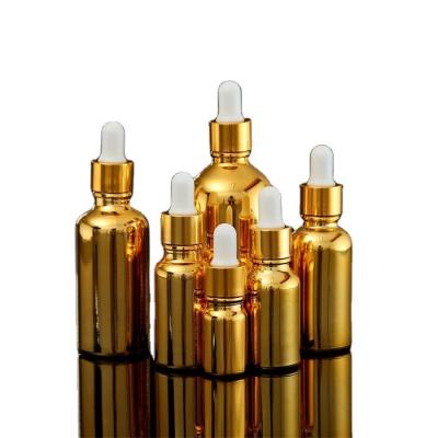 China Private Label Cosmetic Unique Gold Bottles 10ml/20ml/30ml/50ml/100ml Essential Oil Glass Dropper Bottle for sale