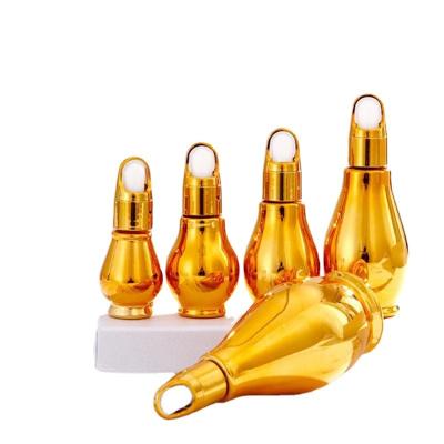 China Bowling 50ml/100ml cosmetic design plated gold essential oil glass bottle with dropper for sale