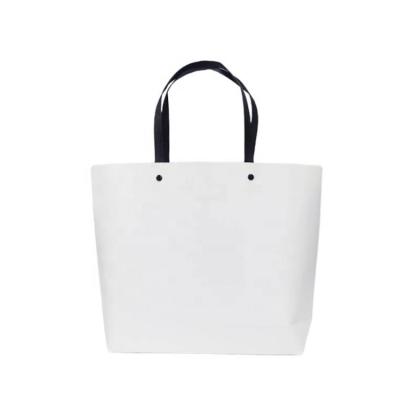 China Wholesale Custom Handmade Logo Paper Bag High Quality Cheap Shopping Paper Bag for sale