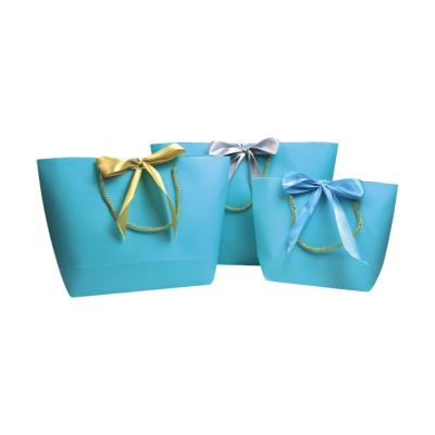 China Moisture Proof Printed Your Own Logo Packaging Kraft Gift Craft Shopping Paper Bag With Ribbon Handles for sale