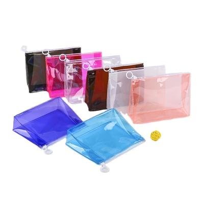 China Colorful Transparent PVC Zipper Biodegradable Travel Bags Makeup Bikini Zipper Lock Slider Cosmetic Packaging Bag Stand Up Pouch for sale