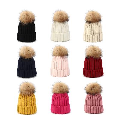 China New JOINT large hair ball hat women and children outdoor wild raccoon knitted warm hats winter beanies hats for sale