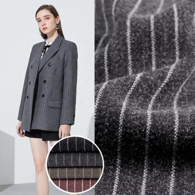 China Latest Design Anti Static Control Knitting Brushed Flannel Brush Fleece Fabric For Winter Coat Jackets for sale