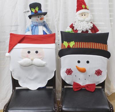 China Christmas Interior Decoration Modern Red Chair Covers Snowman Santa Claus Style Christmas Dining Chair Covers for sale