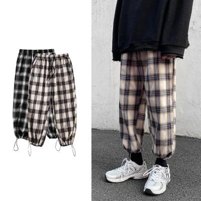 China Anti-wrinkle fashion men's tall loose plaid harem pants drawstring waist drawstring long pants loose casual youth men drop down sports pants for sale