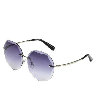 China Fashion Sunglasses 2020 New Metal Elegant Lens Women Rimless Sunglasses Custom Wholesale Ocean for sale